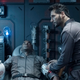 Alex (Cas Anvar) tends to a wounded Martian.